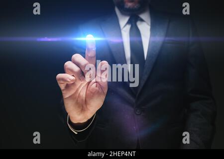 Business technology innovation concept, businessman pressing virtual screen button with copy space for text, selective focus Stock Photo