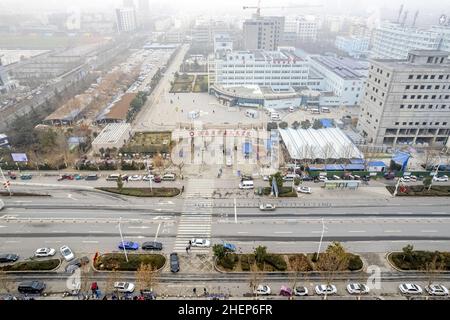 Anyang, Anyang, China. 12th Jan, 2022. On January 11, 2022, in the locked area of Hua county, Anyang City, Henan Province, the ''empty city'' photographed by UAV aerial photography, people stayed at home, cars were not on the road, and the operation was suspended. On January 8th, a case of asymptomatic infection of Covid-19 appeared in Huaxian, Anyang, Henan province. It immediately upgraded the epidemic control measures and strengthened the management of the village (Village). The county is divided into sealed control area, control area and prevention area according to the epidemic preventi Stock Photo