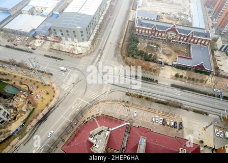 Anyang, Anyang, China. 12th Jan, 2022. On January 11, 2022, in the locked area of Hua county, Anyang City, Henan Province, the ''empty city'' photographed by UAV aerial photography, people stayed at home, cars were not on the road, and the operation was suspended. On January 8th, a case of asymptomatic infection of Covid-19 appeared in Huaxian, Anyang, Henan province. It immediately upgraded the epidemic control measures and strengthened the management of the village (Village). The county is divided into sealed control area, control area and prevention area according to the epidemic preventi Stock Photo