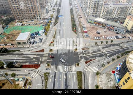 Anyang, Anyang, China. 12th Jan, 2022. On January 11, 2022, in the locked area of Hua county, Anyang City, Henan Province, the ''empty city'' photographed by UAV aerial photography, people stayed at home, cars were not on the road, and the operation was suspended. On January 8th, a case of asymptomatic infection of Covid-19 appeared in Huaxian, Anyang, Henan province. It immediately upgraded the epidemic control measures and strengthened the management of the village (Village). The county is divided into sealed control area, control area and prevention area according to the epidemic preventi Stock Photo