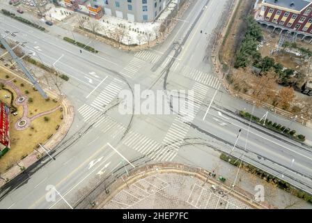 Anyang, Anyang, China. 12th Jan, 2022. On January 11, 2022, in the locked area of Hua county, Anyang City, Henan Province, the ''empty city'' photographed by UAV aerial photography, people stayed at home, cars were not on the road, and the operation was suspended. On January 8th, a case of asymptomatic infection of Covid-19 appeared in Huaxian, Anyang, Henan province. It immediately upgraded the epidemic control measures and strengthened the management of the village (Village). The county is divided into sealed control area, control area and prevention area according to the epidemic preventi Stock Photo