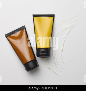 Color plastic tubes with white cream strokes Stock Photo