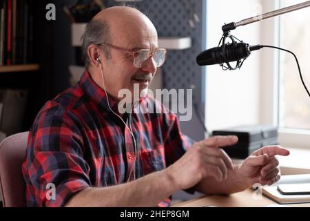 Senior businessman motivation speaker using video camera making video for blog Stock Photo