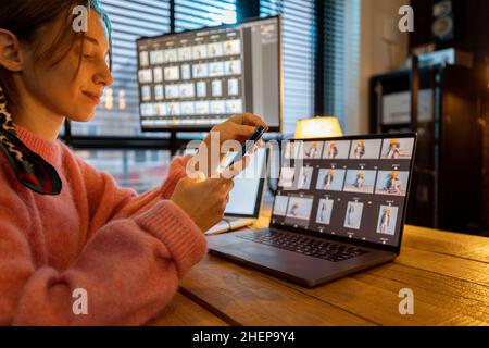 Photographer editing photos at home office Stock Photo