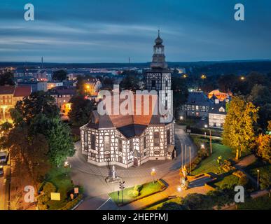 Milicz, Poland.  Aerial view of Half-timbered church of Saint Andrew Bobola at dusk Stock Photo