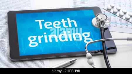 The word Teeth grinding on the display of a tablet Stock Photo
