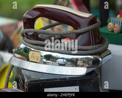 old electric iron on a flea market , Austria Stock Photo