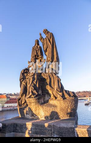 Statue of St. Cyril and St. Methodius, at charles bridge on a blue sky background, Prague Stock Photo