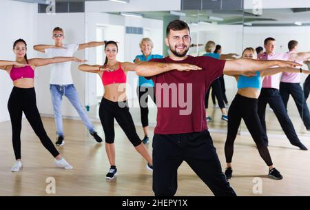 adults of different ages dancing at dance class Stock Photo