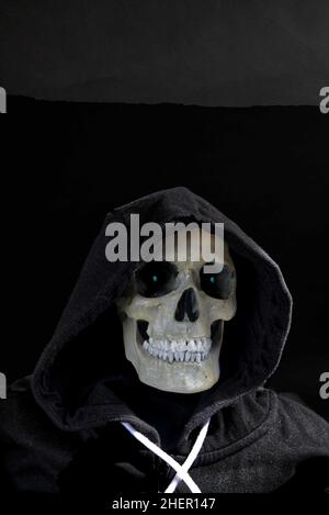 Death in a hoodie, portrait of human skull wearing a hoodie. Stock Photo