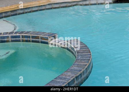 Empty swimming pool with blue water Stock Photo