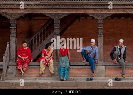 Locals enjoying some down time in Durbar Square, Bhaktapur, during Nepali New Year (Bisket Jatra) festivities. Stock Photo