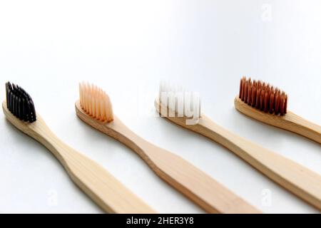 Eco-friendly bamboo toothbrushes on white background. Natural organic bathroom beauty product concept. Flat lay, top view, copy space Stock Photo