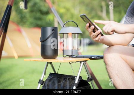 Men using a Smart speaker with smartphone. Stock Photo