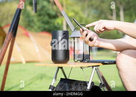Men using a Smart speaker with smartphone. Stock Photo