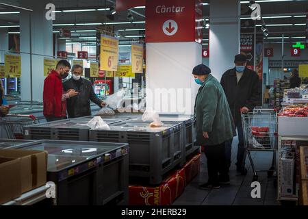 Chisinau, Moldova - October 17, 2021 Inside the supermarket. Elderly men and women wearing medical masks select food inside a Vellmart supermarket. Stock Photo