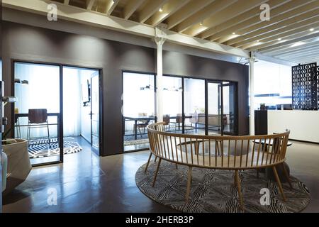 Interior of illuminated modern office with lobby and board room Stock Photo