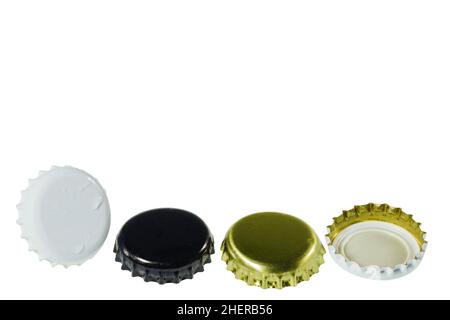 Close up view of four different black and white metal caps with drops isolated on white background. Stock Photo