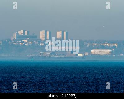 Sheerness, Kent, UK. 12th Jan, 2022. UK Weather: the end of Southend-on-sea's world famous pier shrouded in a light sea mist in the afternoon sun as seen from Sheerness, Kent. Credit: James Bell/Alamy Live News Stock Photo