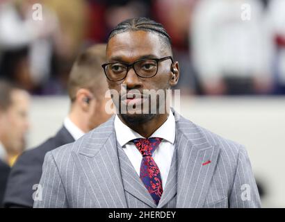 ESPN analyst Robert Griffin III wears a jersey honoring injured Buffalo  Bills defensive back Damar Hamlin while walking behind the end zone during  halftime of an NFL football game between the Jacksonville