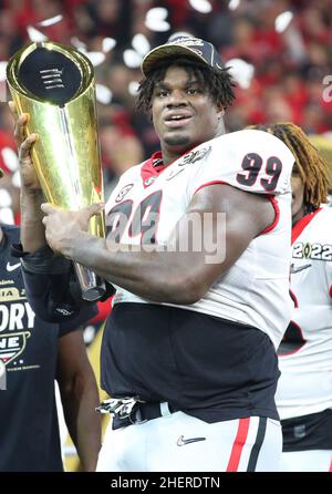 Georgia Bulldogs defensive lineman Jordan Davis (99) celebrating during the  trophy presentation of the 2022 CFP college football national championship  game at Lucas Oil Stadium, Monday, Jan. 10, 2022, in Indianapolis. Georgia