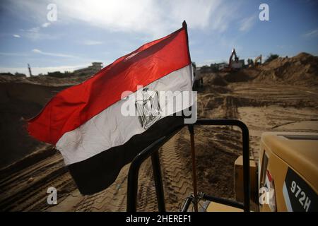 Gaza, Palestine. 12th Jan, 2022. Gaza, Palestine - 12 Jan 2022, Egyptian flag seen on a bulldozer working at the construction of the city of 'Misr 3' in the American School neighborhood in the city of Beit Lahia northern Gaza Strip.The Egyptian Committee for the Reconstruction of the Gaza Strip had announced its donation of 500 million dollars in June 2021 as assistance from the Egyptian government for the reconstruction of the Gaza Strip after the fighting round between Hamas and Israel in May 2021. Credit: SOPA Images Limited/Alamy Live News Stock Photo