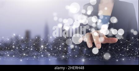 Background big data visualization futuristic technology. Hand touch digital screen hologram sign on city light blurred background Stock Photo