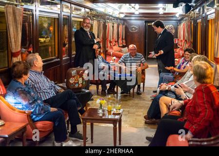 Magic tricks show inside Al-Andalus luxury train travelling around Andalusia Spain.  The Al Andalus train takes a tour of 7 days and 6 nights, visitin Stock Photo