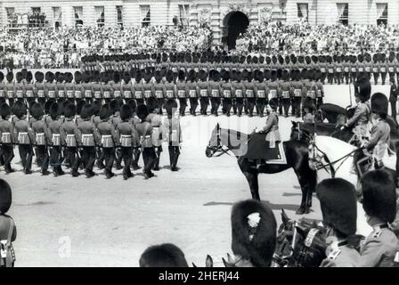 London, England, UK. 03rd June, 1978. The annual Trooping the Colour Ceremony took place today to mark the official birthday of Her Majesty on Horse Guards Parade. The Colour Trooped was that of the 2nd Battalion Grenadier Guards. H.M. QUEEN ELIZABETH II, right, on her horse 'Burmese' watches the march past during the Trooping the Colour Ceremony on Horse Guards Parade today. Credit: Keystone Press Agency/ZUMA Wire/Alamy Live News Stock Photo