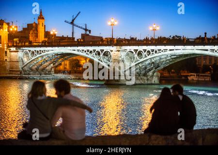 Isabel II bridge or Triana bridge. Guadalquivir river. Seville, Andalusia, Spain. Stock Photo