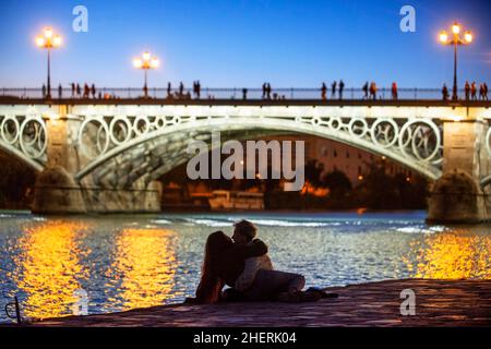 Isabel II bridge or Triana bridge. Guadalquivir river. Seville, Andalusia, Spain. Stock Photo