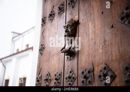 Door knocker on the Monserrate Basílica Santuario del Señor de Monserrate hilltop, popular with pilgrims & tourists. Bogotá, Bogota, Colombia Stock Photo