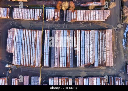 Stacks of bricks in the brickyard warehouse. Bricks production factory aerial Stock Photo