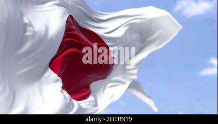 Detailed close up of the national flag of Japan waving in the wind on a clear day. Democracy and politics. Asian country. Selective focus. Stock Photo