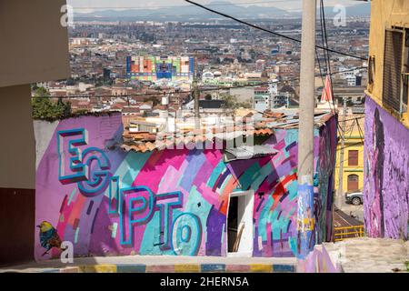Street art murals on house walls in the once notorious gang Barrio Egipto neighbourhood, Bogota, Colombia, South America. Tourist tours now visit. Stock Photo