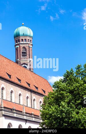 Frauenkirche in Munich with tree in front Stock Photo