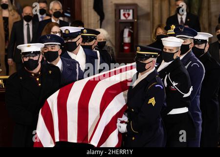 USA. 12th Jan, 2022. A U.S. Joint Forces bearer team carries the flag-draped casket of former Senate Majority Leader Harry Reid, D-NV, inside the U.S. Capitol where he will lie in state, Wednesday, Jan. 12, 2022, in Washington. Reid, who served five terms in the Senate, will be honored Wednesday in the Capitol Rotunda during a ceremony closed to the public under COVID-19 protocols. (Photo by Pool/Sipa USA) Credit: Sipa USA/Alamy Live News Stock Photo