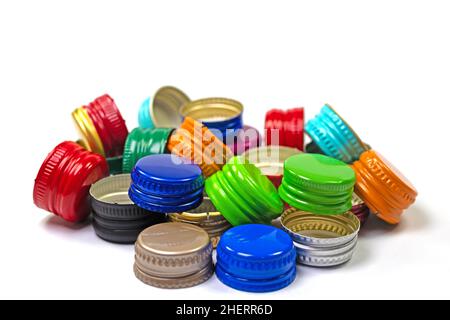 Old tinplate bottle caps against a white background Stock Photo