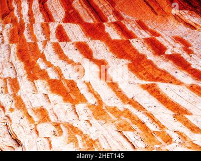 Abstract of alternating red and white stripes in zig zag pattern in sandstone rock at White Pocket area Vermilion Cliffs National Monument Arizona. Stock Photo