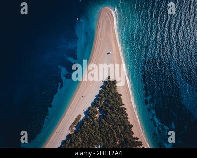 Famous Zlatni rat beach in Bol, Island Brac, Croatia, Europe. Also called golden horn or golden cape. April, 2021. Stock Photo