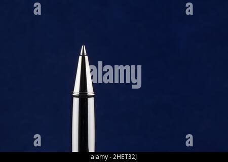 Roller ball pen point isolated on a blue background Stock Photo