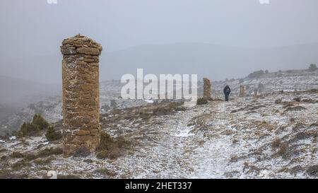 Woman Hiking Along the Ancient Path Los Pilones in Villarroya de los Pinares, Teruel, Aragon, spain Stock Photo