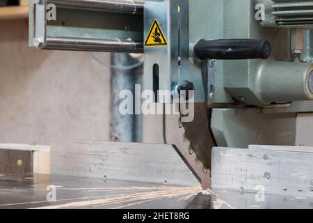 circular buzz saw on table with rail and grip of carpenter Stock Photo