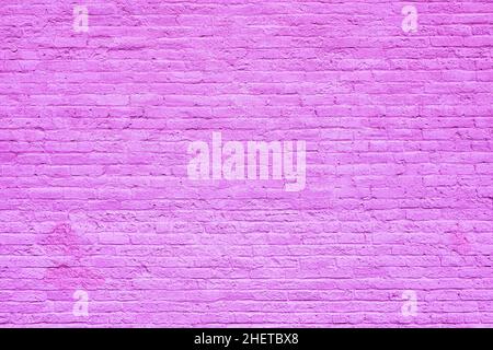harmonic old brick wall painted in violet as background Stock Photo