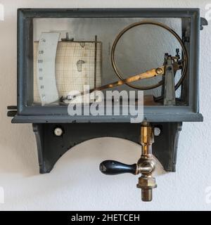 old retro hygrometer weather station at wall Stock Photo
