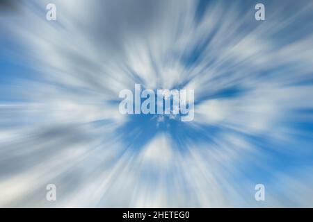 Clouds in motion blur on blue sky. Stock Photo
