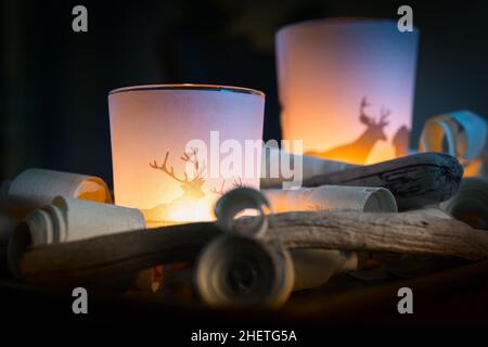 romatic light of two candles in glass with wood decoration Stock Photo