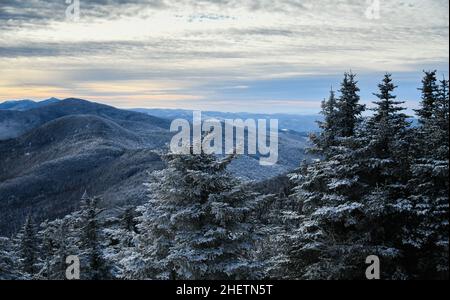 Scenic winter mountains landscape. Pine trees covered with snow. Stowe, Vermont. Stock Photo