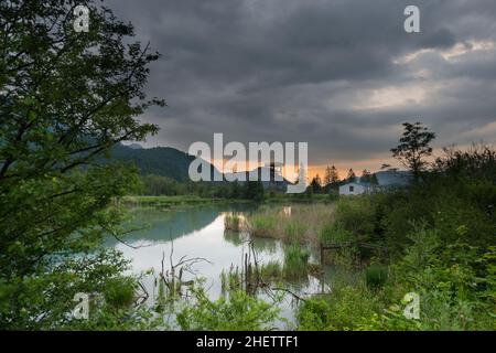 stormy weather over swamp with bird tower Stock Photo