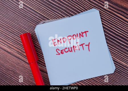 Endpoint Security write on sticky notes isolated on Wooden Table. Stock Photo
